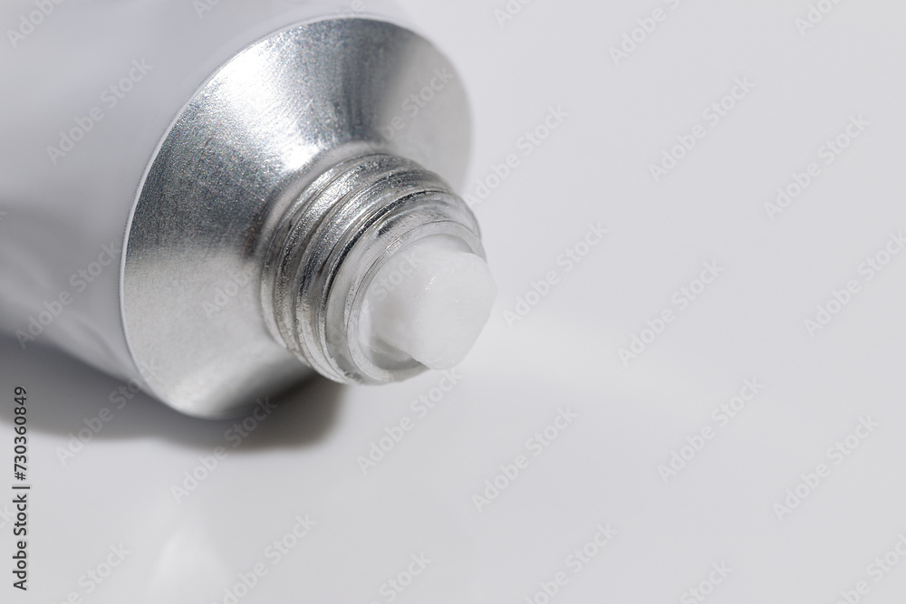 Close-up of an Aluminum Cream Tube. Pharmacy Treatment. Mockup Close-up of an Aluminum Cream Tube. Pharmacy Treatment. Mockup
