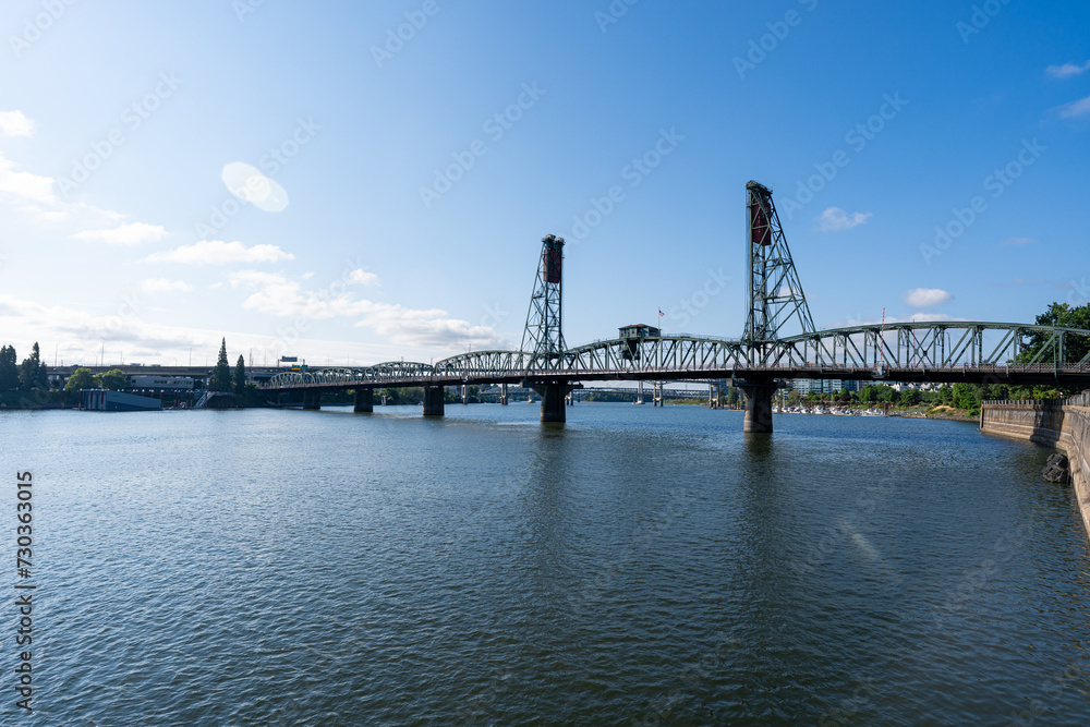 A wide-angle photo of the Portland Hawthorne Bridge which passes over the Willamette River.