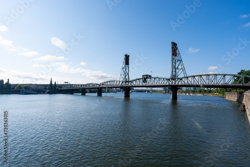 A wide-angle photo of the Portland Hawthorne Bridge which passes over the Willamette River. © Eli