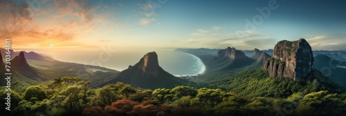A panoramic view of majestic mountains overlooking a coastal landscape at sunrise