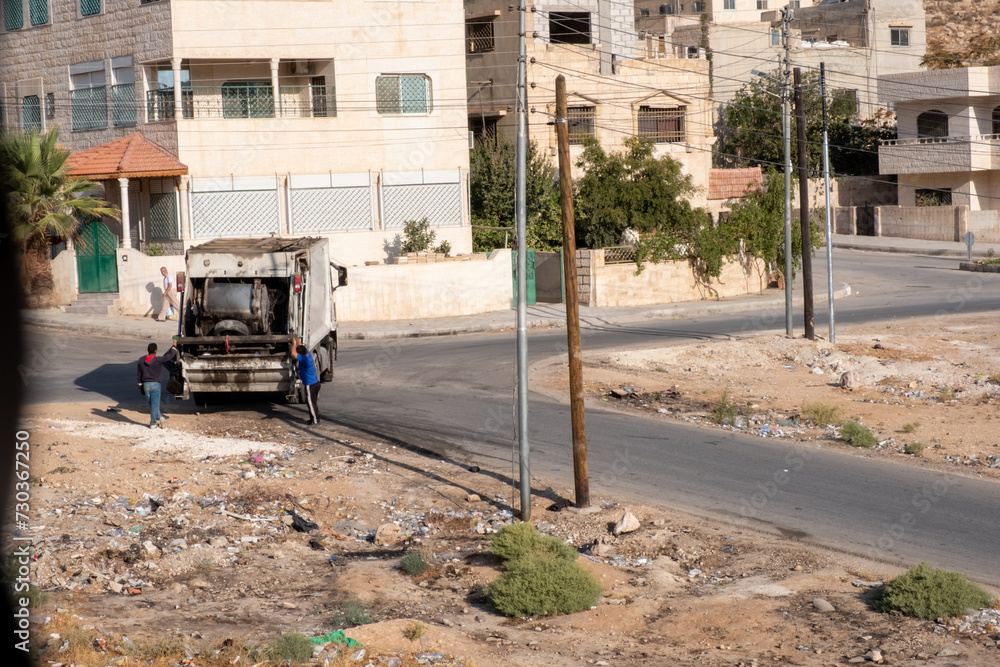 garbage cleaning in arabic countries with two worker