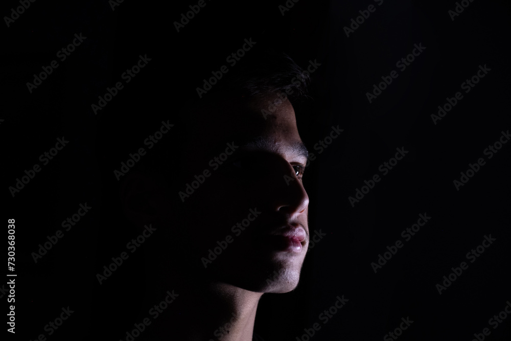 Portrait for teenager in dark and light studio