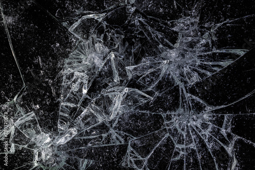Pieces of Broken Glass Shattered on a Black Background