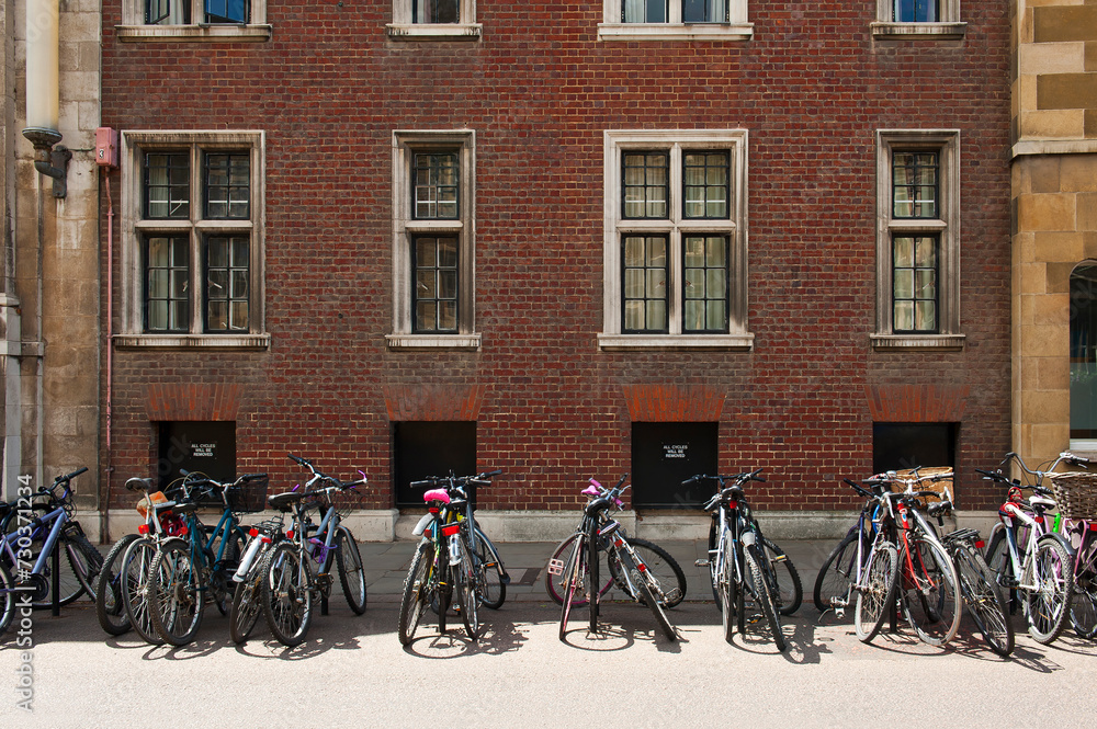 Many bicycles standing in a row in Cambridge, England