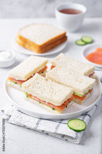 Salmon cucumber dill cream cheese tea sandwich in a plate