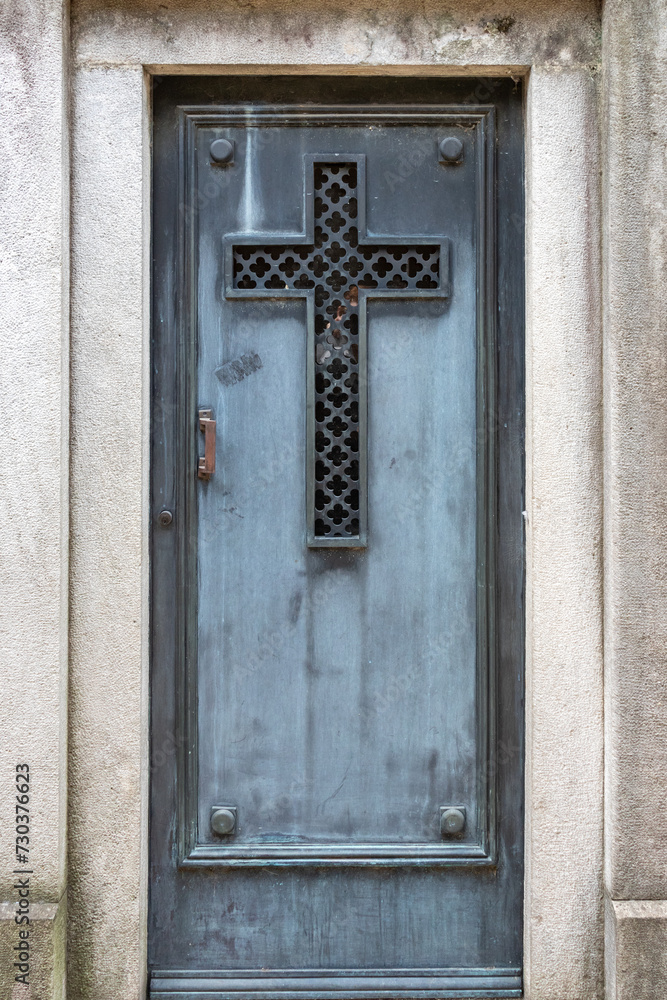  Blue Wooden Door with a Carved Cross in a Mausoleum at Recoleta Cemetery, Buenos Aires, Argentina 