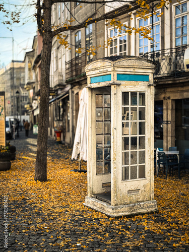 Autumn city landscape with typical white telephone booth in Chaves, Vila Real, Tras os Montes, Portugal. photo