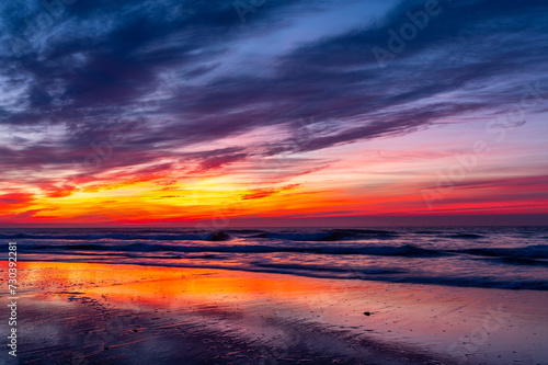 Colorful Reflections from Twilight Sky on Beach