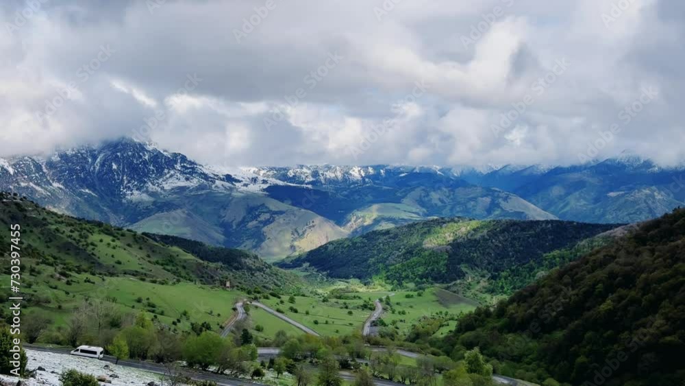 Tseylomsky pass in Ingushetia. A trip uphill to the Tsei Loam pass on a cloudy spring day. Panorama of the high cliffs of the Dzheyrakh gorge. North Caucasus, Russia. 4К Tseylomsky pass in Ingushetia. A trip uphill to the Tsei Loam pass on a cloudy spring day. Panorama of the high cliffs of the Dzheyrakh gorge. North Caucasus, Russia. 4К