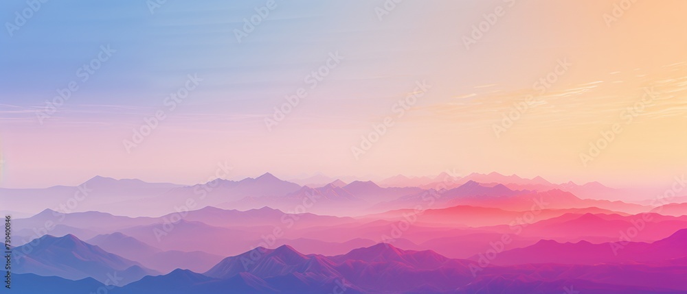 Panoramic view of colorful mountain silhouettes under a gradient dawn sky.