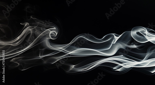 white smoke floats on a black background in