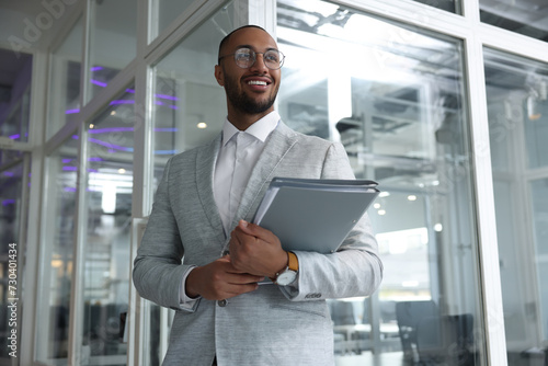 Happy man with folders in office. Lawyer, businessman, accountant or manager