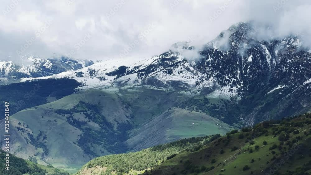 Tseylomsky pass in Ingushetia. A trip uphill to the Tsei Loam pass on a cloudy spring day. Panorama of the high cliffs of the Dzheyrakh gorge. North Caucasus, Russia. 4К Tseylomsky pass in Ingushetia. A trip uphill to the Tsei Loam pass on a cloudy spring day. Panorama of the high cliffs of the Dzheyrakh gorge. North Caucasus, Russia. 4К