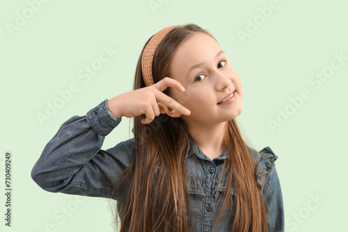 Cute little girl making hea...