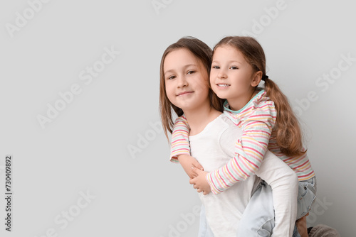 Cute little sisters hugging...