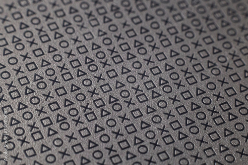 Pattern of symbols and signs on a flat grey surface
