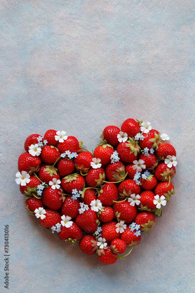 Strawberry with white flowers in the shape of a heart on a decorative background, postcard, copy space, happy birthday, Valentine's Day. Strawberry with white flowers in the shape of a heart on a decorative background, postcard, copy space, happy birthday, Valentine's Day.