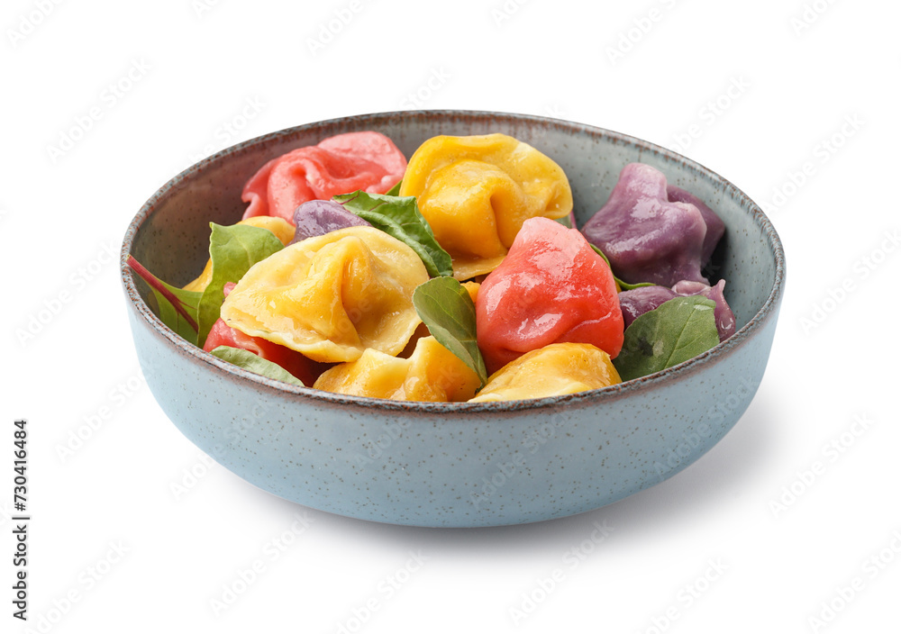 Bowl with boiled colorful dumplings and spinach on white background Bowl with boiled colorful dumplings and spinach on white background