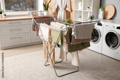 Dryer with clean clothes in laundry room