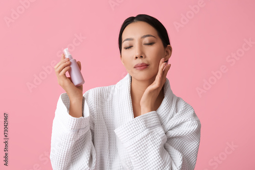 Young Asian woman in bathro...
