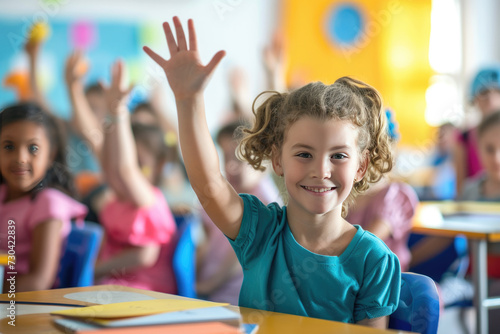 Children raise their hands to answer in the classroom. Back To School concept photo