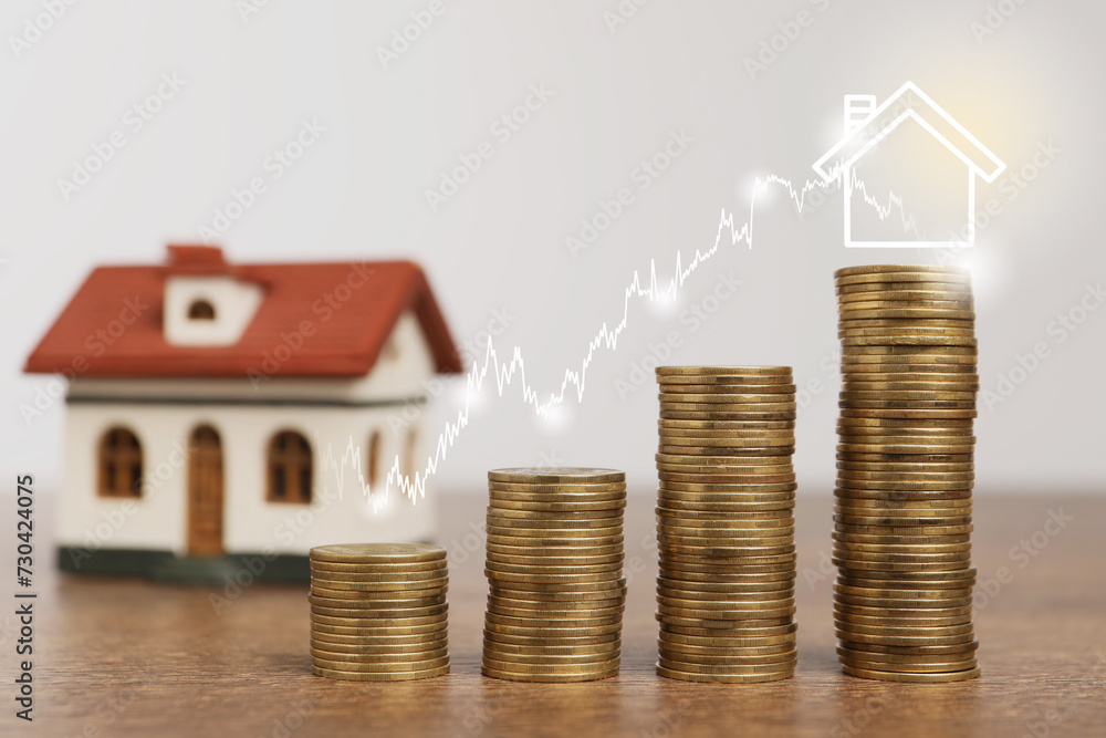 Mortgage rate. Stacked coins, graph and model of house Mortgage rate. Stacked coins, graph and model of house