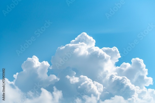 Fluffy white cloud, detailed texture, on a bright azure sky background