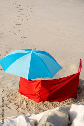 blue umbrella on a sandy beach