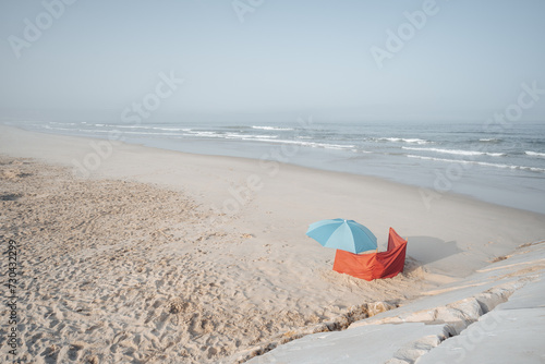 blue umbrella on a sandy beach