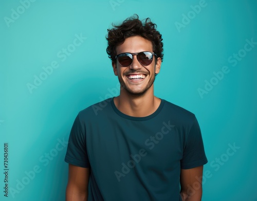 Portrait of young smiling man wearing glasses isolated on turquoise background with space for inscriptions or text.generative ai