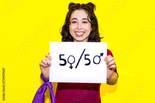 Φωτογραφία Exuberant Woman Championing Gender Balance with 50/50 Sign