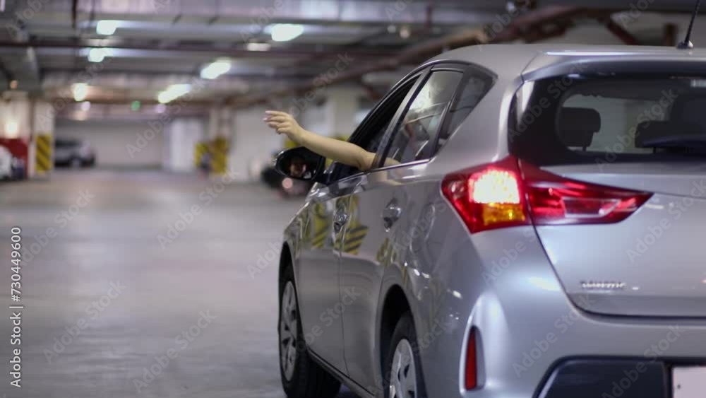 Hands of woman moves to music from drivers place of car, then window closed. Slow motion Hands of woman moves to music from drivers place of car, then window closed. Slow motion