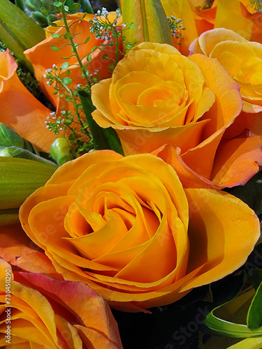 A bouquet of Yellow roses with greenery.