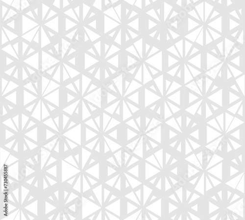 Subtle minimal vector seamless pattern with small randomly scattered triangles, floral shapes, hexagonal grid. Light gray and white modern texture. Stylish background with halftone effect. Geo design