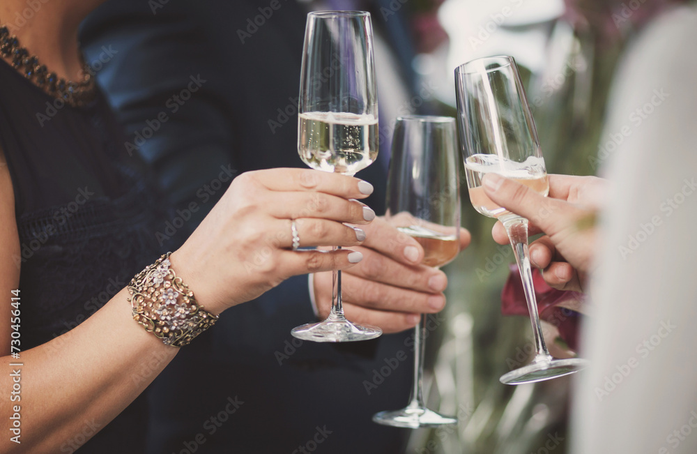 People having party with champagne cheers. Hands holding the glasses of champagne making a toast. People having party with champagne cheers. Hands holding the glasses of champagne making a toast.
