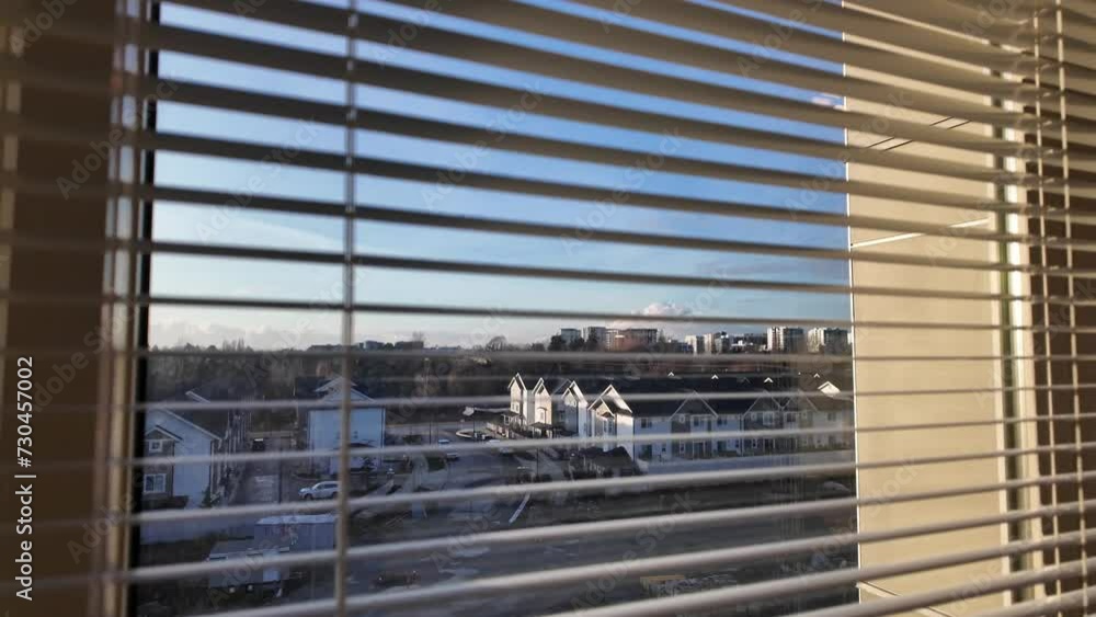 Urban View Through Window Blinds in Bright Daylight Urban View Through Window Blinds in Bright Daylight