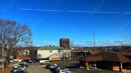 View from North Main St. towards the Ten Story Glass Tower Black High Rise Marquette Credit Union Building Property, Social Flatlands, Downtown City of Woonsocket RI Rhode Island USA. Urban Renewal. 