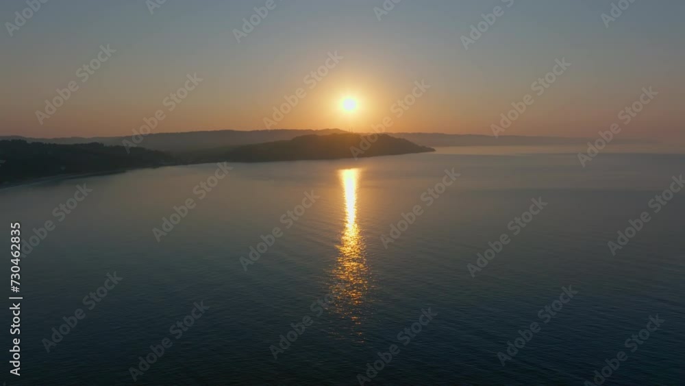 Static drone shot of a peaceful sea at dawn Static drone shot of a peaceful sea at dawn