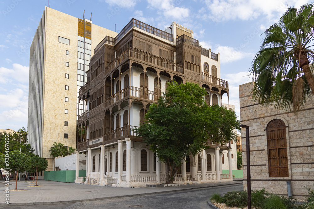 Traditional Hijazi tower house with wooden Rosan windows and balconies.