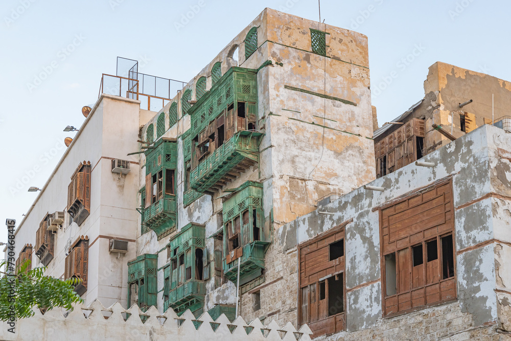 Traditional Hijazi tower house with wooden Rosan windows and balconies.