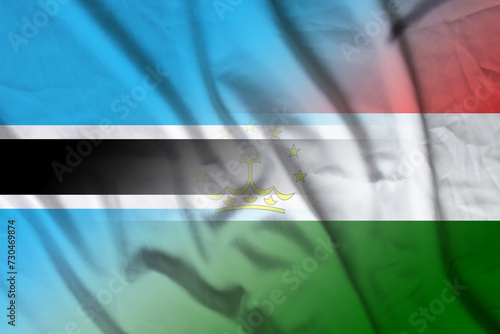 Botswana and Tajikistan political flag transborder contract TJK BWA photo