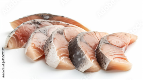Close-up view of fresh, neatly sliced fish fillets, showcasing their natural texture and color gradients.