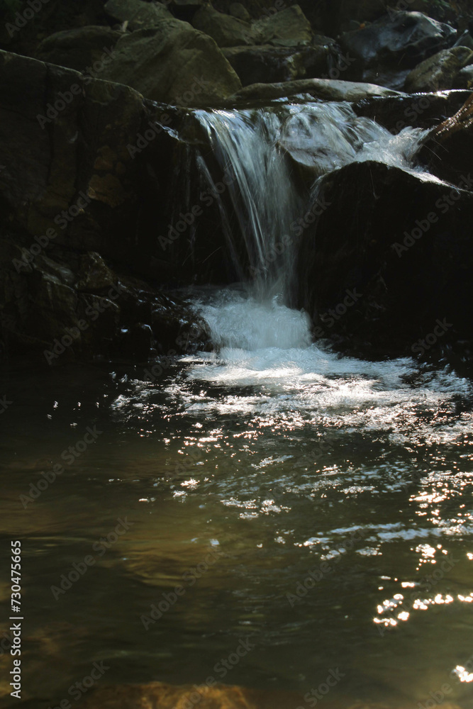 Naklejka premium waterfall in the mountains