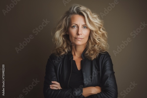 Portrait of a beautiful middle aged woman in a black jacket.