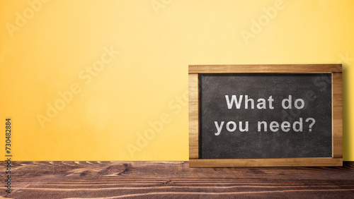 Text of \'What do you need?\' on the chalkboard. Symbol of The customer\'s needs