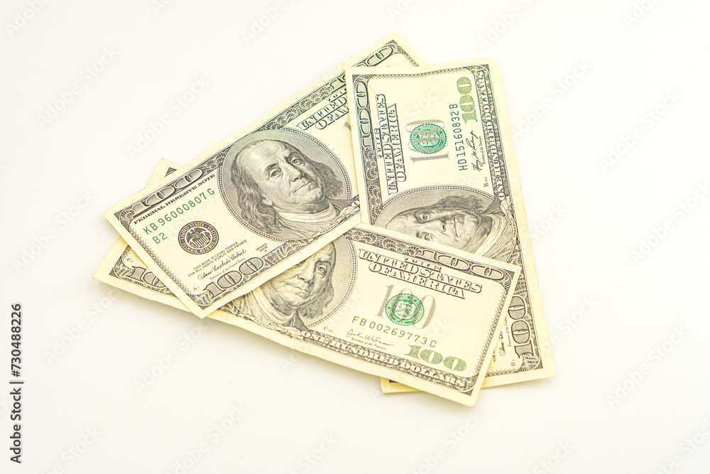 Lots of 100 dollar bills, the concept of US cash money. US paper money. Bribery with a wad of money, cash circulation and money exchange currency. Background of 100 dollar bills Lots of 100 dollar bills, the concept of US cash money. US paper money. Bribery with a wad of money, cash circulation and money exchange currency. Background of 100 dollar bills