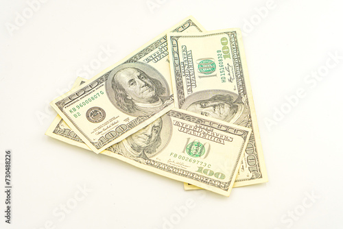 Lots of 100 dollar bills, the concept of US cash money. US paper money. Bribery with a wad of money, cash circulation and money exchange currency. Background of 100 dollar bills