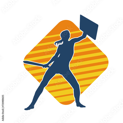 Silhouette of a female warrior in battle armor carrying sword weapon and iron shield.
