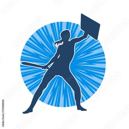 Silhouette of a female warrior in battle armor carrying sword weapon and iron shield.