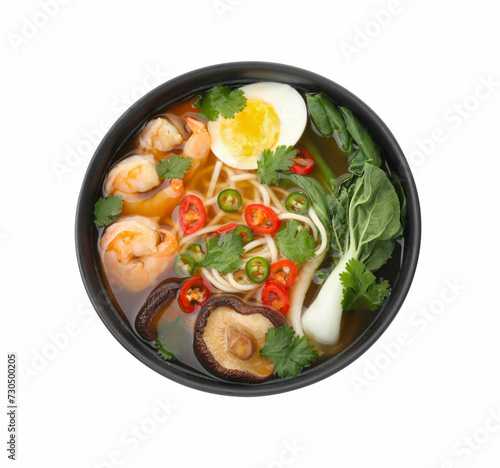 Delicious ramen with shrimps and egg in bowl isolated on white, top view. Noodle soup